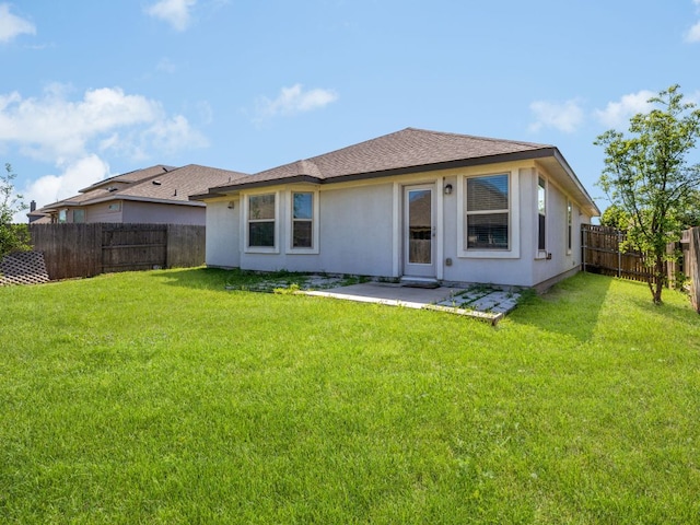 180 Tailwind Dr, Kyle, TX 78640 - rear view of property with a fenced backyard, stucco siding, a patio, and a shingled roof