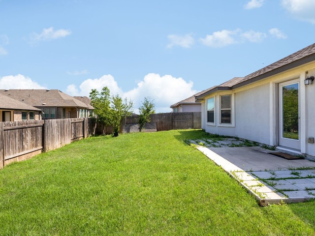 180 Tailwind Dr, Kyle, TX 78640 - fenced backyard with a patio area