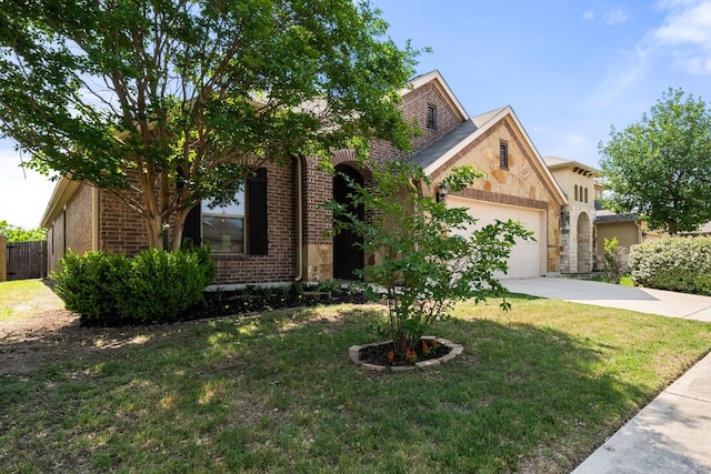 535 Tranquility Mtn, Buda, TX 78610 - view of front of home with concrete driveway, brick siding, and a garage