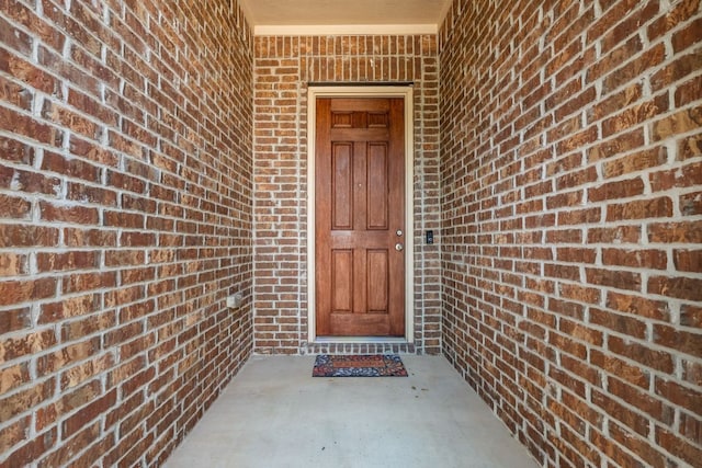 535 Tranquility Mtn, Buda, TX 78610 - doorway to property featuring brick siding