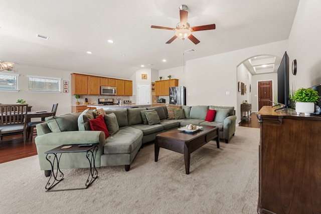 535 Tranquility Mtn, Buda, TX 78610 - living room with arched walkways, a ceiling fan, vaulted ceiling, and recessed lighting
