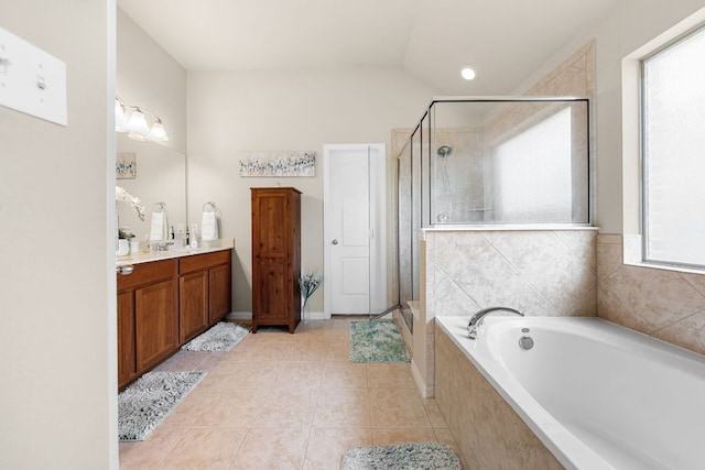 535 Tranquility Mtn, Buda, TX 78610 - full bath with vanity, a stall shower, a garden tub, and tile patterned floors