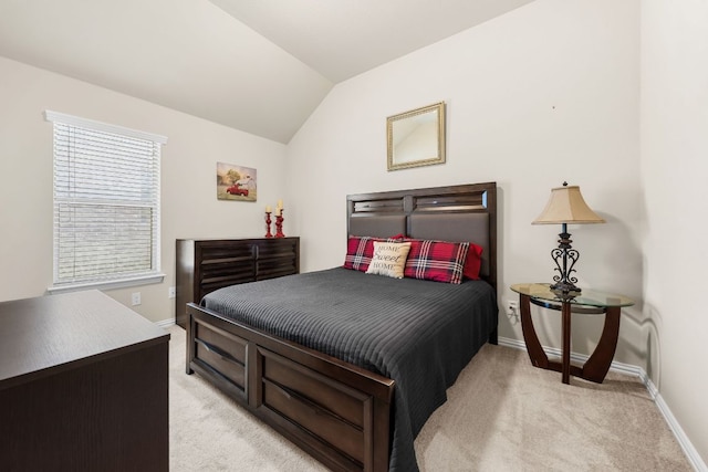 535 Tranquility Mtn, Buda, TX 78610 - bedroom featuring light colored carpet, vaulted ceiling, and baseboards