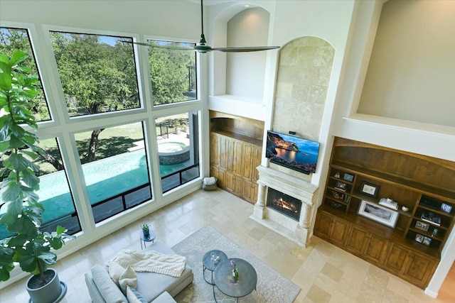 5711 Pool Canyon Cv, Austin, TX 78734 - living room with plenty of natural light, a premium fireplace, and ceiling fan