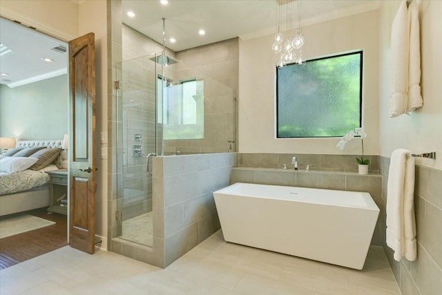 5711 Pool Canyon Cv, Austin, TX 78734 - full bathroom with a soaking tub, ornamental molding, ensuite bath, a shower stall, and tile walls