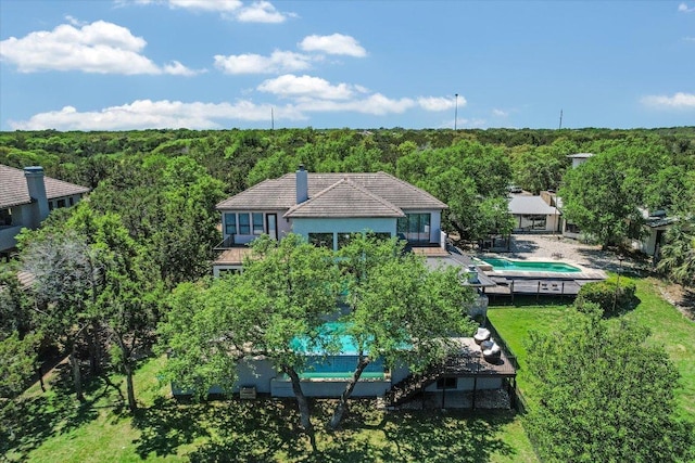 5711 Pool Canyon Cv, Austin, TX 78734 - view from above of property with a pool area and a forest