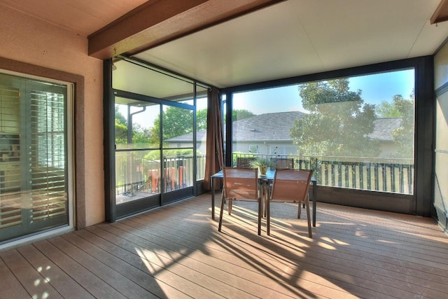 802 Apache Mountain Ln, Georgetown, TX 78633 - sunroom / solarium featuring hardwood / wood-style floors, outdoor dining space, and a wall of windows