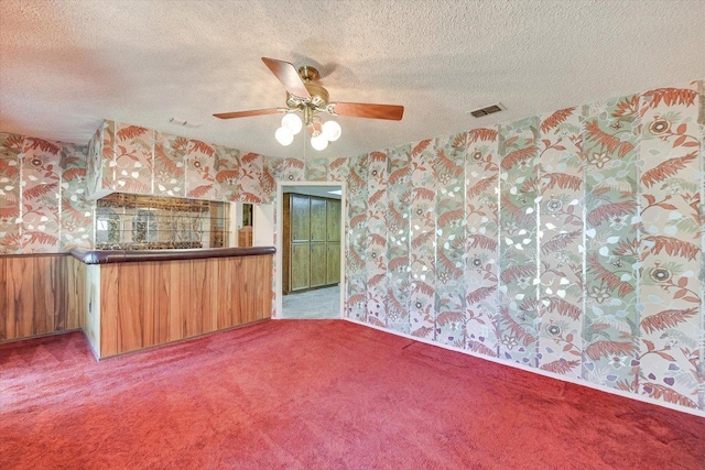 9401 Cedar Crest Dr, Austin, TX 78750 - kitchen featuring wallpapered walls, carpet, ceiling fan, and a textured ceiling