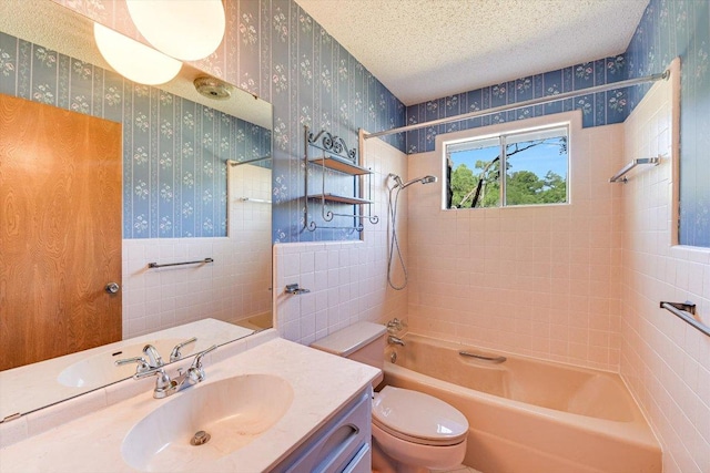 9401 Cedar Crest Dr, Austin, TX 78750 - bathroom featuring wallpapered walls, shower / washtub combination, toilet, vanity, and wainscoting