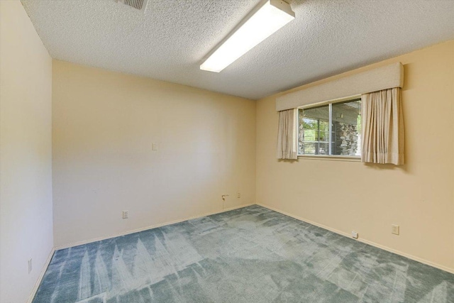 9401 Cedar Crest Dr, Austin, TX 78750 - carpeted empty room featuring a textured ceiling and baseboards
