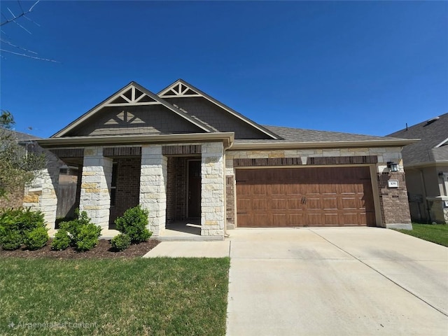 view of front facade with stone siding, concrete driveway, and a garage