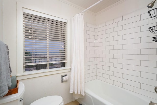 full bathroom with crown molding, shower / bath combo with shower curtain, and toilet