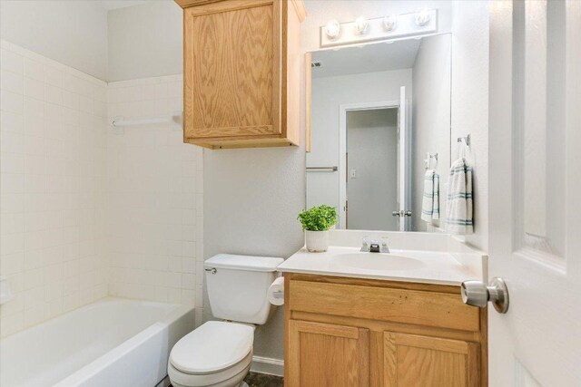 full bath with shower / bathing tub combination, vanity, and toilet