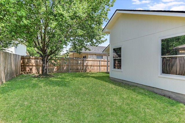 view of yard with a fenced backyard