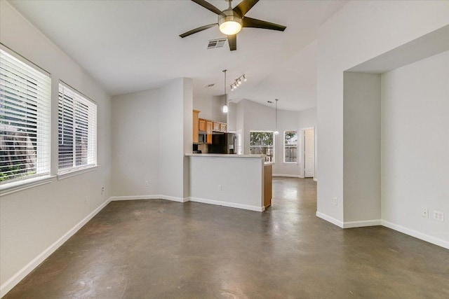 unfurnished living room with finished concrete floors, ceiling fan, baseboards, lofted ceiling, and visible vents
