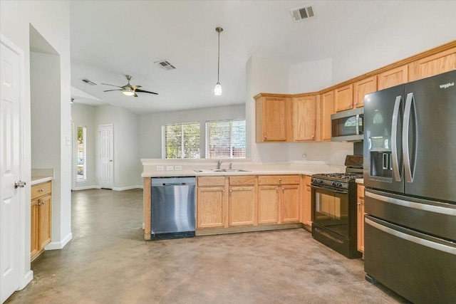 kitchen featuring light countertops, stainless steel appliances, visible vents, and a sink