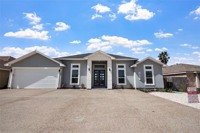15621 Finistere St, Corpus Christi, TX 78418 - ranch-style home featuring an attached garage, driveway, fence, and stucco siding