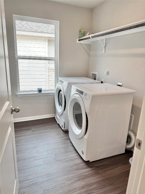 793 Lone Peak Way, Dripping Springs, TX 78620 - laundry room with washer and clothes dryer and wood finished floors