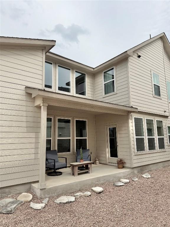 793 Lone Peak Way, Dripping Springs, TX 78620 - back of house with a patio area