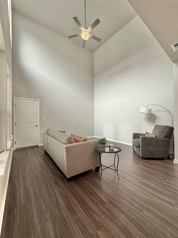 793 Lone Peak Way, Dripping Springs, TX 78620 - living room with dark wood-style flooring, ceiling fan, and a high ceiling