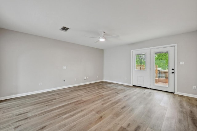 8139 Evadean Cir, Austin, TX 78745 - unfurnished room with light wood-style floors, a ceiling fan, and baseboards
