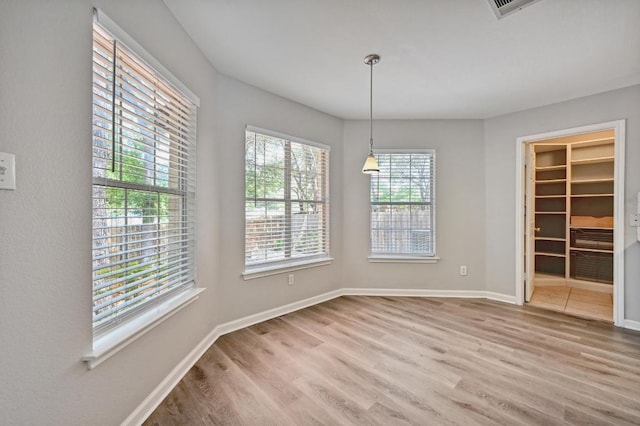 8139 Evadean Cir, Austin, TX 78745 - unfurnished dining area featuring wood finished floors and baseboards
