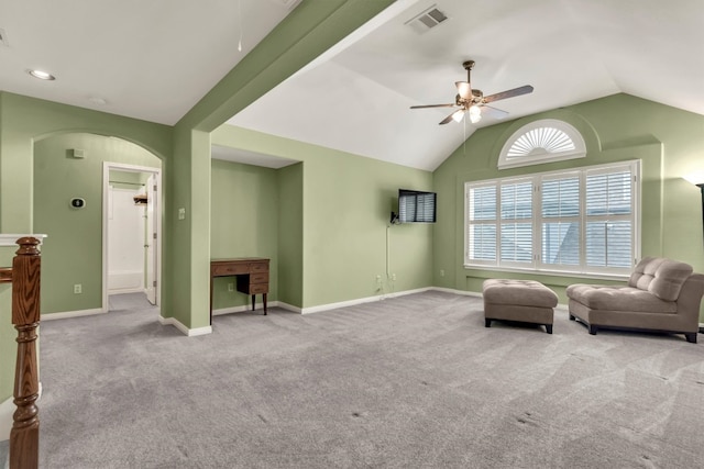 3820 Lagoona Dr, Round Rock, TX 78681 - living area with ceiling fan, arched walkways, lofted ceiling, carpet floors, and baseboards