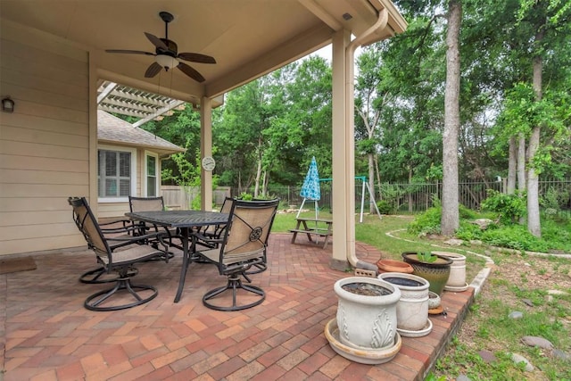 3820 Lagoona Dr, Round Rock, TX 78681 - fenced backyard featuring a ceiling fan, a patio, outdoor dining space, and view of scattered trees