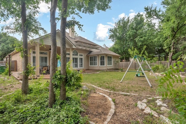 3820 Lagoona Dr, Round Rock, TX 78681 - back of house featuring a playground and a chimney