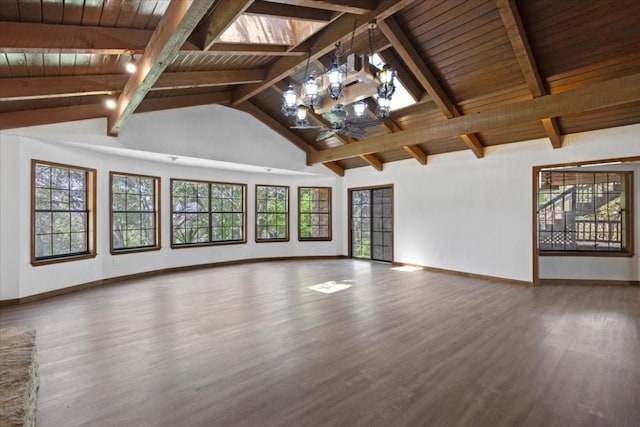 502 Grace Ln, Austin, TX 78746 - unfurnished living room with wood finished floors, baseboards, a chandelier, wooden ceiling with exposed beams, and high vaulted ceiling
