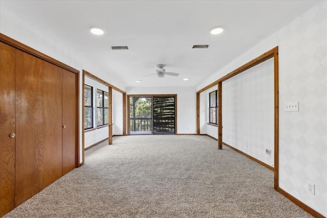 502 Grace Ln, Austin, TX 78746 - unfurnished room featuring carpet flooring, a ceiling fan, baseboards, recessed lighting, and wallpapered walls