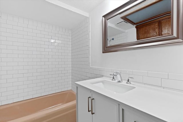 502 Grace Ln, Austin, TX 78746 - full bathroom featuring vanity, tile walls, and shower / tub combination