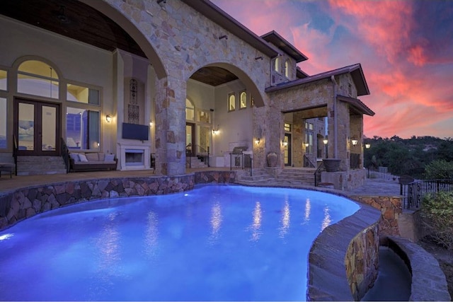 8315 Lime Creek Rd, Volente, TX 78641 - outdoor pool featuring exterior fireplace and a patio