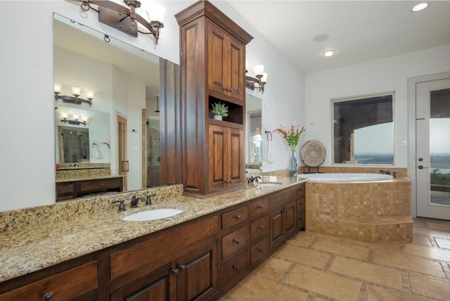 8315 Lime Creek Rd, Volente, TX 78641 - full bath featuring double vanity, a bath, and recessed lighting