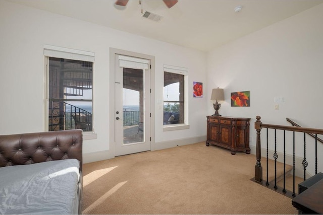 8315 Lime Creek Rd, Volente, TX 78641 - carpeted bedroom featuring access to exterior and a ceiling fan