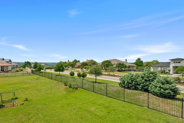 view of yard with fence and a residential view