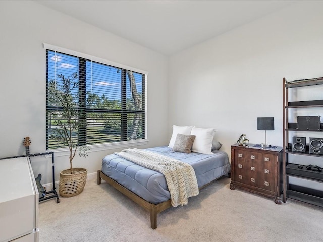 bedroom featuring carpet flooring and baseboards