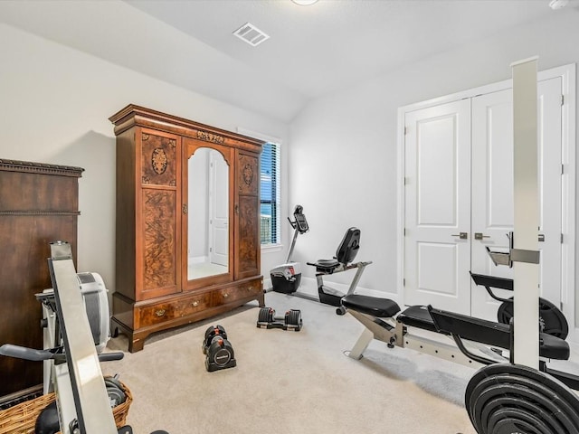 workout area with vaulted ceiling, carpet floors, and visible vents