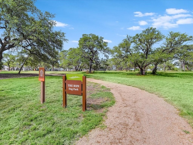 view of home's community with a yard