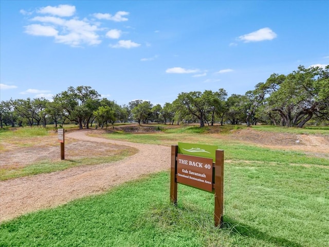 view of property's community with a yard