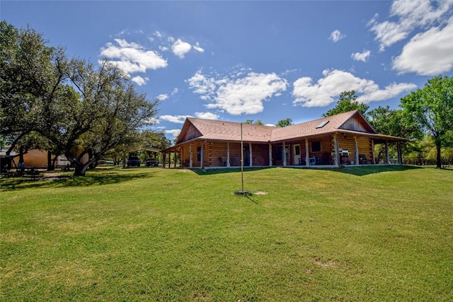 back of house with a lawn and log exterior