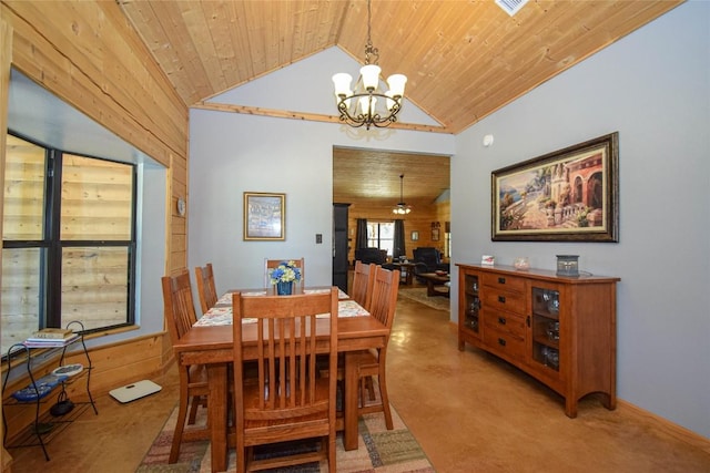 dining room with a chandelier, wooden walls, wood ceiling, and light colored carpet
