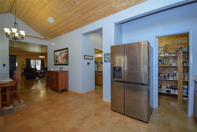 kitchen featuring ceiling fan with notable chandelier, stainless steel refrigerator with ice dispenser, concrete floors, and wood ceiling
