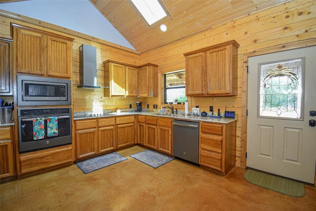 kitchen with wall chimney exhaust hood, appliances with stainless steel finishes, wood walls, and vaulted ceiling