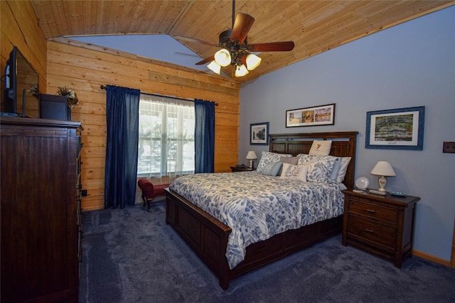 bedroom featuring vaulted ceiling, wooden walls, ceiling fan, dark carpet, and wooden ceiling