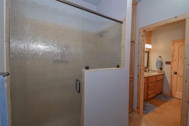 full bathroom with vanity and a stall shower