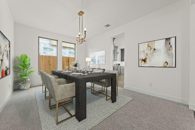 7413 Desert Needle Dr, Lago Vista, TX 78645 - dining room featuring light colored carpet, a chandelier, and baseboards