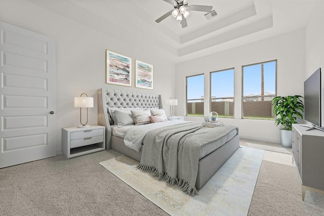 7413 Desert Needle Dr, Lago Vista, TX 78645 - bedroom with light carpet, a raised ceiling, and a ceiling fan