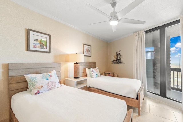 bedroom featuring tile patterned flooring, a ceiling fan, access to outside, and ornamental molding