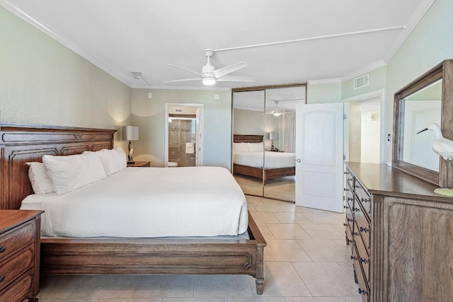 bedroom featuring crown molding, ensuite bathroom, visible vents, and light tile patterned floors